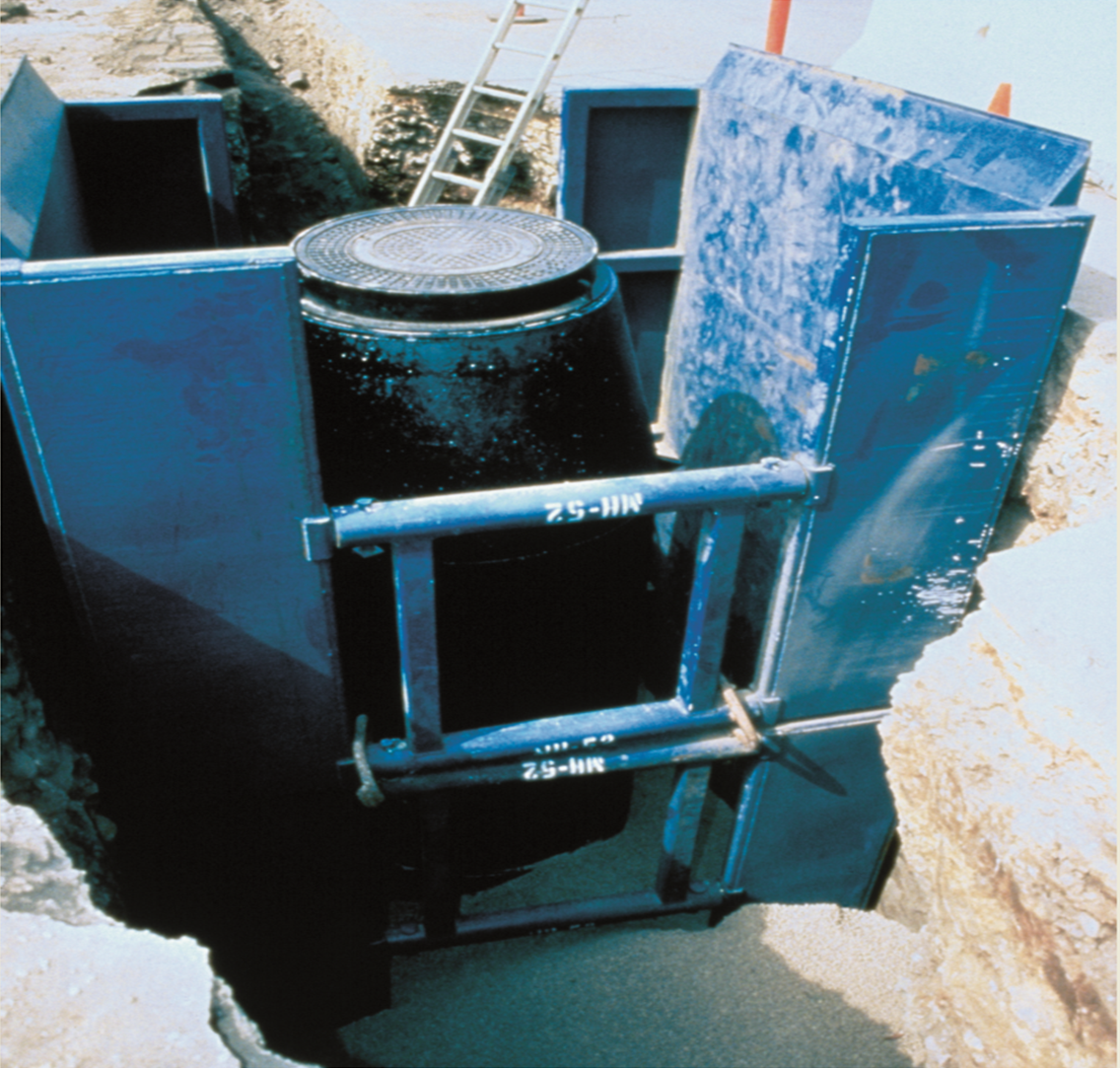 blue manhole shield in use at worksite