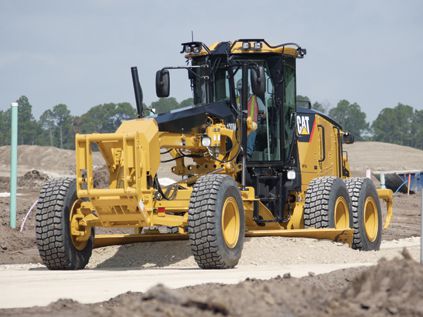 CAT motor grader being used to level the surface at jobsite