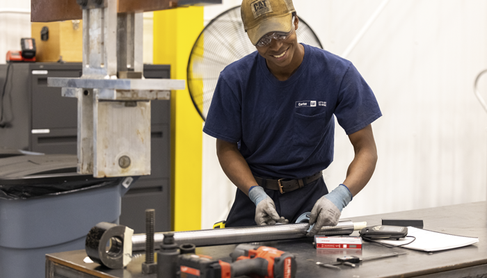 A Carter Cat working on chroming a piece of equipment