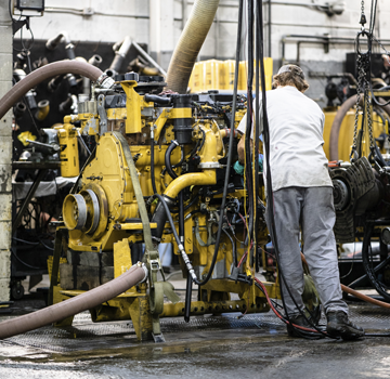 A Carter Cat employee in the middle of completing a machine rebuild