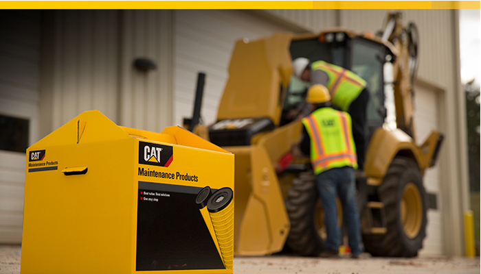Cat maintenance products and two men on a piece of Cat heavy machinery