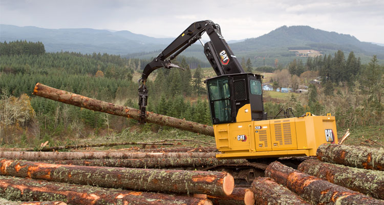 Cat log loader transporting logs 