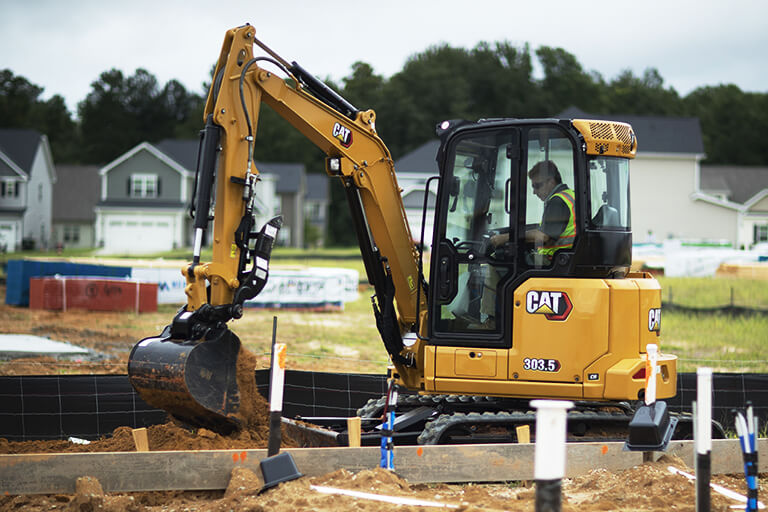 Cat 303.5 excavator on jobsite