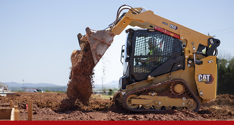 Compact Track Loader dumping dirt